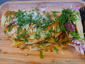 "Make it vegan" vegetable quesadilla (vegan cheese and squash inside) and custom crispy corn taco at Turco Taco in Naples