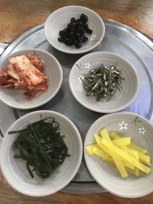 Banchan- Sides. kimchi, soy braised soy beans, kelp, yellow radish (be careful as kimchi might contain fish sauce)  at Korean Soy Silken Tofu 우리콩순두부 in Busan