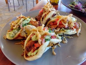 This was one order of vegan burgers, plenty for two! It was so good! Crispy French onions, creamy avocado sauce, veggies, and a delicious veggie-style burger. at Enhorio in Samos