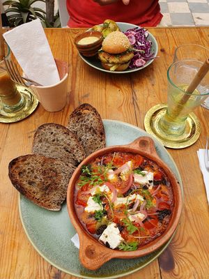 Delicious tofu dish (shakshofu) and burger at Redclay Cafe in Taghazout