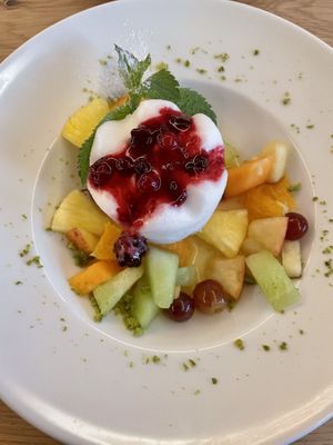 Half board desert: lemon sorbet with fruit salad  at Hotel Klausen Pass in Unterschaechen