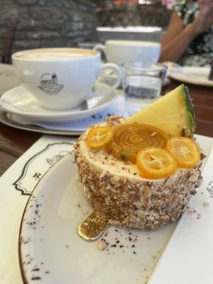 Carrot cake with exotic fruits and lavender cappuccino   at Apátsági Rege Cukrászda in Tihany