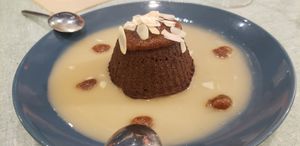 Chocolate fondant with creme anglaise at Le Jardin in Biarritz