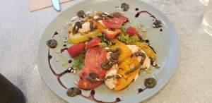 Tomate "mozza" pesto, served with bread at Le Jardin in Biarritz