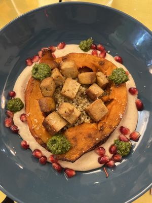 Courge rôtie, tofu, quinoa, hoummous, grenade, sauce chimichuri   at Le Jardin in Biarritz