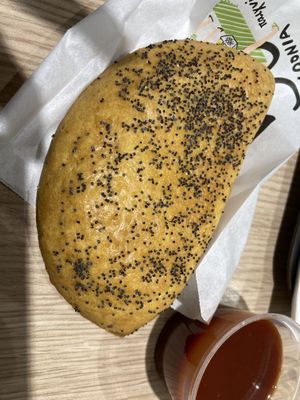 vegan cheese pie (sauce does not come with it, we ordered extra ketchup)  at ATH - Gregory's - Departures in Athens