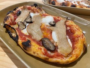 Vegan chicken and mushroom pizza slice, 160 baht (plus 7% tax)  at Vegano in Bangkok