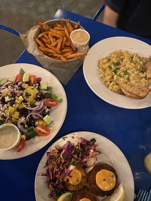 Yam fries, mac and cheese, greek salad with almond cheese, “crab” cakes (their summer special)!!!!!  at Seva in Detroit