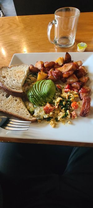 Brunch tofu scramble with vegan cheese and avo with toast at Seva in Detroit