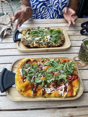 Truffle pizza and black olive pizza  at Bresca - San Antonio in Ibiza
