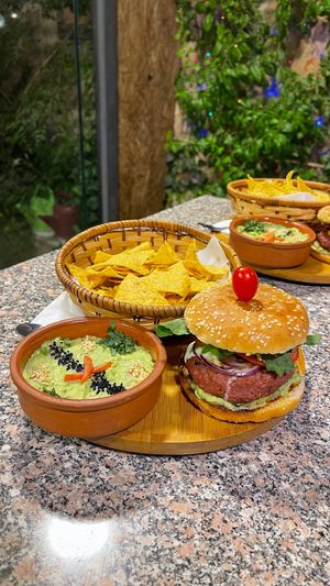 Vegan burger & avocado dip at Carob Restaurant in Amman