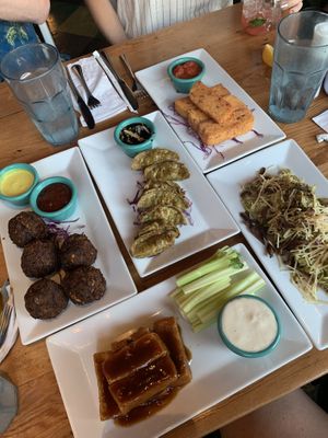 Veggie burger, spinach gyoza, polenta sticks, Brussels spout coleslaw, and teriyaki tofu wings   at The Cafe in Key West