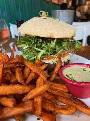 Cafe Veggie Burger (bun not gluten-free) with gluten-free sweet potatoes fries. at The Cafe in Key West