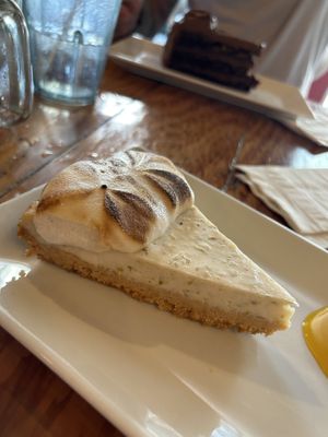 Key lime cheesecake and chocolate cake in background   at The Cafe in Key West