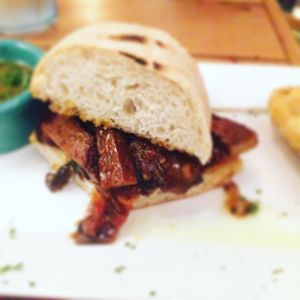 Peppersteak sandwich with seitan and mushrooms inside at The Cafe in Key West