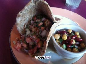 Curried 'chicken' salad sandwich with side salad and falafel sandwich with marinated bean salad.  at The Cafe in Key West