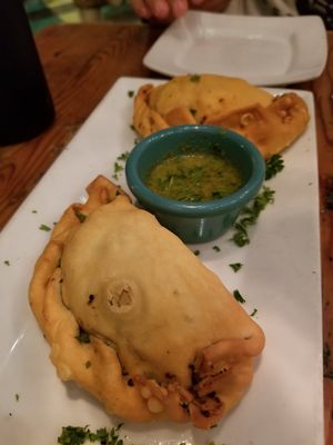 Curry butternut squash empanadas with lime dipping sauce (app special) at The Cafe in Key West