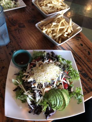 Portobello salad and a generous portion of the crispiest fries around. at The Cafe in Key West