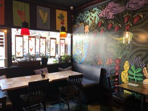 Large comfy window couches with overstuffed pillow for a relaxing time with friends at The Cafe in Key West