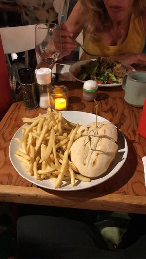 Vegan variation of the Pepper'steak' & Swiss sandwich with Fries. at The Cafe in Key West