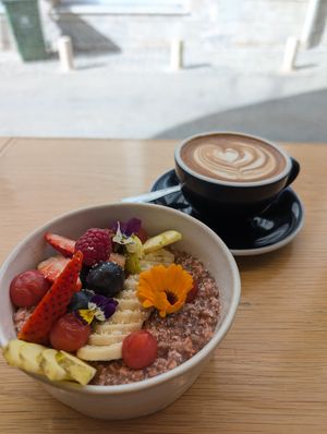 Oat bowl and coffee at Black and White Coffee Shop in Lagos