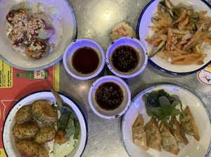 Four tapas items with soy sauces  at Kkokki Vegan House in Hamburg