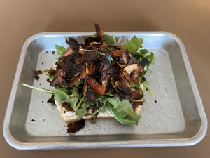 The Wellsbuilt Toast- Coconut bac'n, tomato, arugula, balsamic glaze, vegan mayonnaise, coarse salt & fresh-cracked pepper  at Easy Luck in Orlando