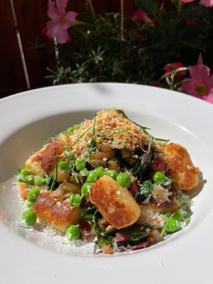 Parisian gnocchi, sautéed local rainbow chard and snow peas with seasoned breadcrumbs and parm cheese (which can easily be left off for vegan!) at One Legged Magpie  in Red Lodge