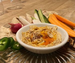 Garlic Hummus with local veggies and house made pita at One Legged Magpie  in Red Lodge