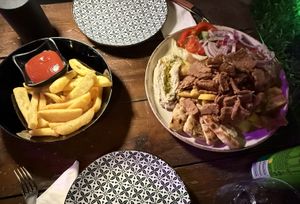 Vegan Gyros with Hummus and extra fries 😋  at Happy Friends in Rhodes