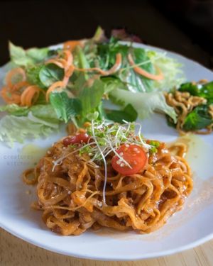 Raw pasta with tomato sauce and salad.  at Raw8 Cafe in Osaka