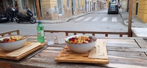 Outdoor seating next to a street at Street Food Two in Pula