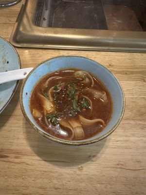 Hand pulled noodles with left over broth  at Hotpot Restaurant Ting Song 随园·听松  in Berlin