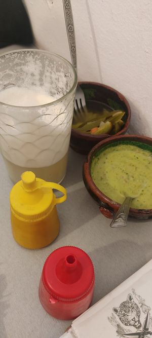 Piñada (the drink) 55 pesos, & free guacamole, jalapeños and mustard/ketchup at Casa Onca Centro in Aguascalientes