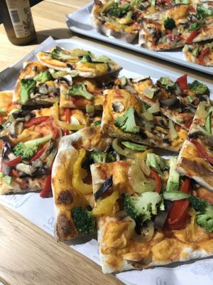 General view of the dishe: we can see a bottle of « Litra », the moldovan brewing company.  at Vino Pizza Wine in Chisinau