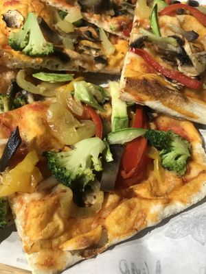 We see here details of the toppings: brocoli, red pepper (not spicy), mushrooms, zucchini. There’s Italian oil (Olio di peperoncino) available for customers.  at Vino Pizza Wine in Chisinau