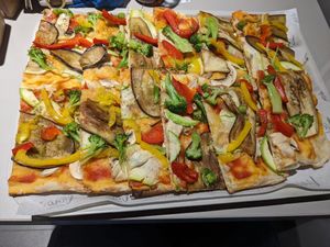 A massive, delicious vegan pizza, which could easily feed two people. at Vino Pizza Wine in Chisinau