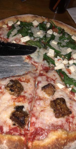 vegan pizza with tempeh on one side and tofu and spinach on the other at Mellow Mushroom in Birmingham