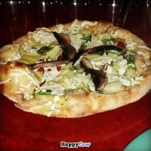 The White Rabbit (veganized): Olive oil & garlic base, sundried tomatoes, spinach, daiya cheese, mushrooms (I asked for portobello), and artichoke hearts. at Mellow Mushroom in Birmingham
