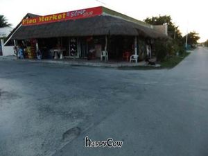 It is on the west side of the street, across from the Flea Market & Silver Shop that is on the corner at Puerto Verde in Puerto Morelos