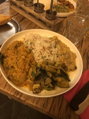Mon plat avec les 4 garnitures choisis, riz + dhal de lentilles corails + caviar d’aubergine + courgettes grillées  at Bollynan in Paris