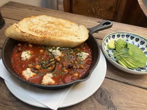 Vegan shakshuka with spicy tomato sauce, crispy chick peas and aubergine  at Our Local  in Cape Town
