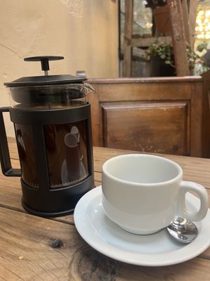 plunger coffee with oat milk  at Our Local  in Cape Town