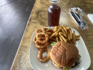 Johns burger meal with fries and onions rings  at The Herbal Farmercy in Greenville
