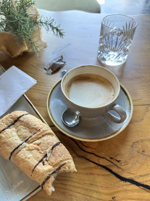 Vegan chocolate roll and cappuccino with oat milk   at Moun10 Bakers in Garmisch-partenkirchen