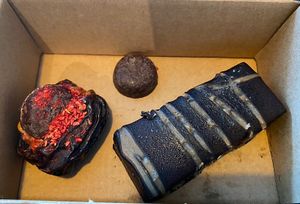 Stuffed date, small chocolate for my daughter and hazelnut bar.  at Loui in Munich