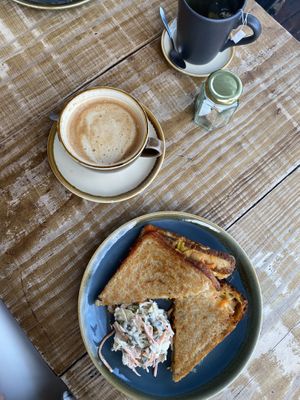 Oat latte. Cheddar, smoke tofu and kimchi toastie with slaw    at Heaphys in Glastonbury