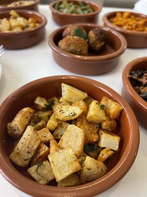 Fried potatoes with falafels in the background  at World Storytelling Cafe in Marrakech