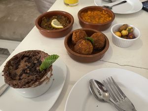 Three small plates with Orange Blossom Cakee  at World Storytelling Cafe in Marrakech