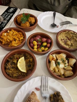 Small plates: Falafel, loubia (stewed beans), olives, hummus, zaalouk (aubergine), herby diced potatoes  at World Storytelling Cafe in Marrakech